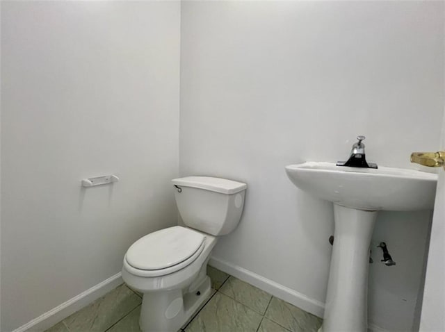 bathroom with sink and toilet