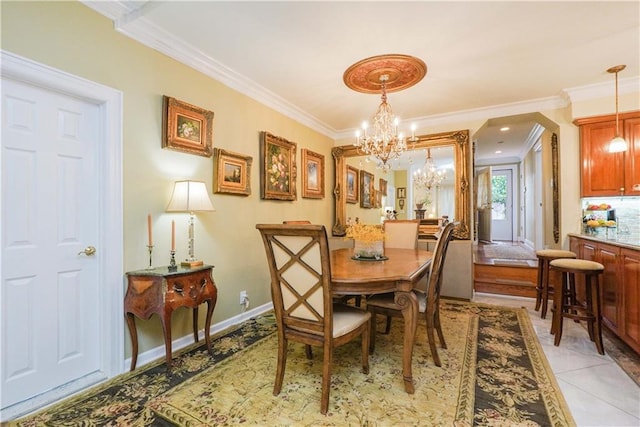 dining space with crown molding, light tile patterned floors, and a notable chandelier