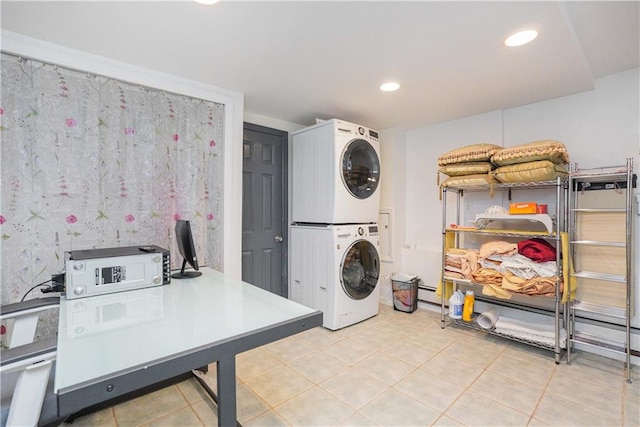 laundry room with stacked washer and dryer and tile patterned floors