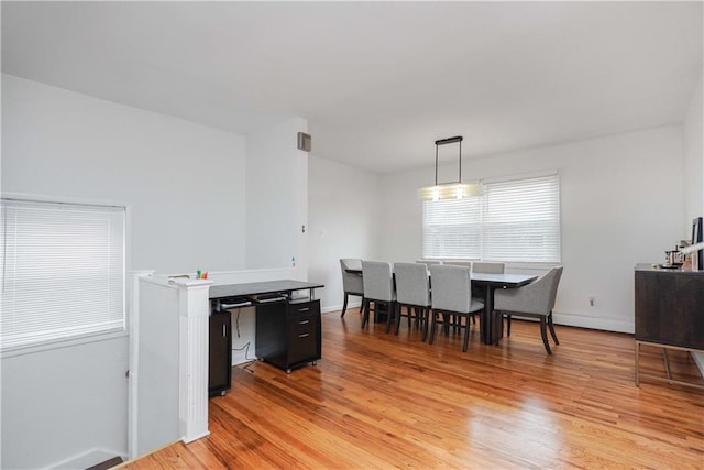 dining space featuring light hardwood / wood-style floors