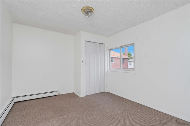 unfurnished bedroom with carpet floors, a textured ceiling, and a closet