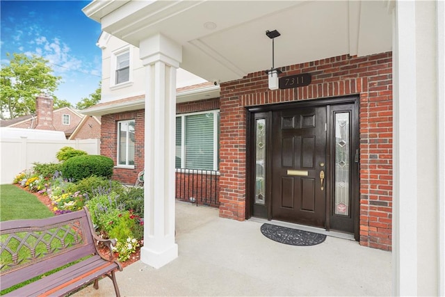 view of exterior entry featuring a porch