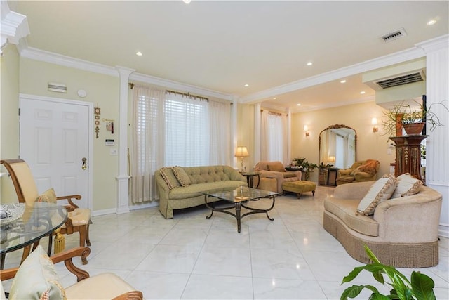 living room featuring ornamental molding and ornate columns