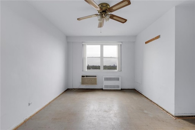 unfurnished room featuring ceiling fan, a wall mounted air conditioner, and radiator