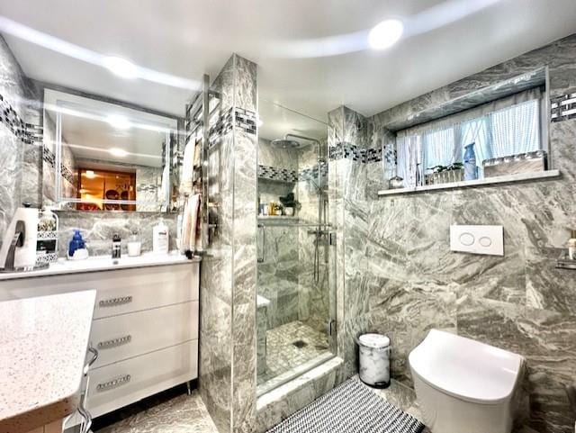 bathroom with walk in shower, vanity, toilet, and tile walls