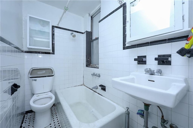 bathroom featuring tile walls, sink, tile patterned floors, and toilet