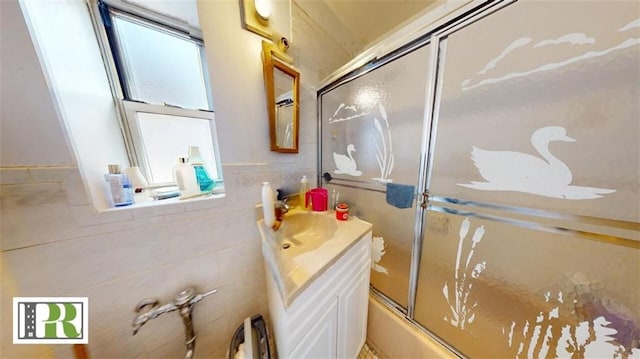 1046 E 32nd St, Brooklyn, NY 11210 - full bath featuring vanity, enclosed tub / shower combo, and tile walls