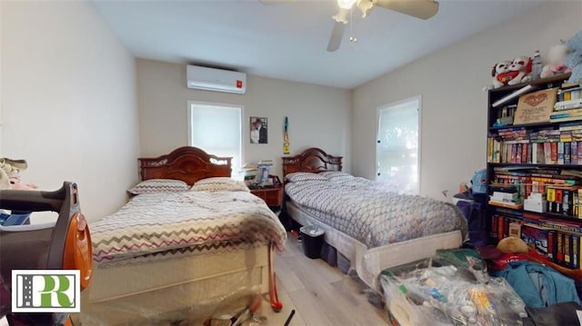 1046 E 32nd St, Brooklyn, NY 11210 - bedroom featuring a wall unit AC, light wood-style floors, and ceiling fan