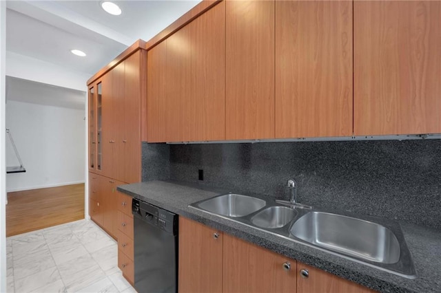 kitchen with decorative backsplash, light wood-type flooring, black dishwasher, and sink