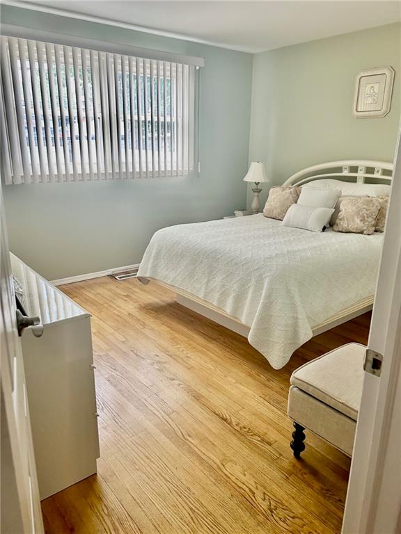 bedroom with light hardwood / wood-style flooring