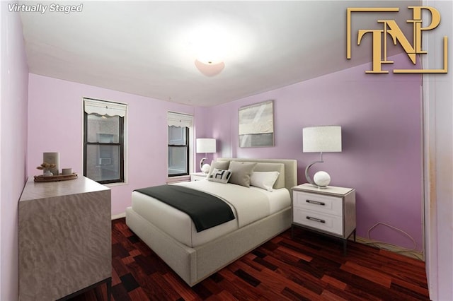 bedroom featuring dark hardwood / wood-style flooring