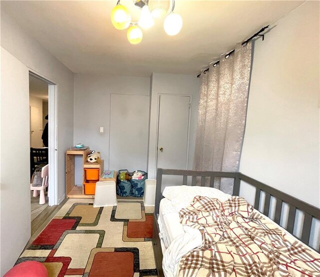 bedroom with a notable chandelier