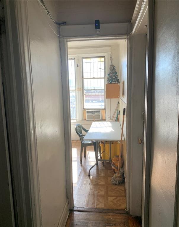 hallway with cooling unit and dark parquet flooring