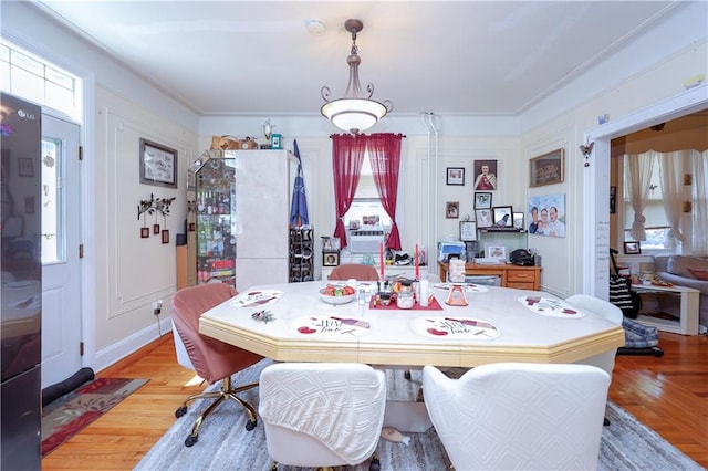 dining space with light wood-style flooring