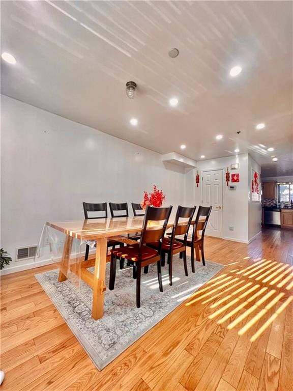 dining area featuring wood-type flooring