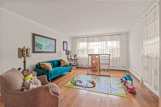 living room featuring hardwood / wood-style flooring and crown molding