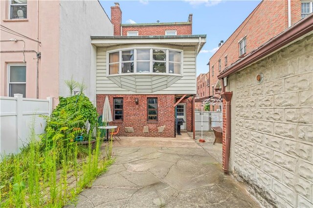 rear view of property featuring a patio