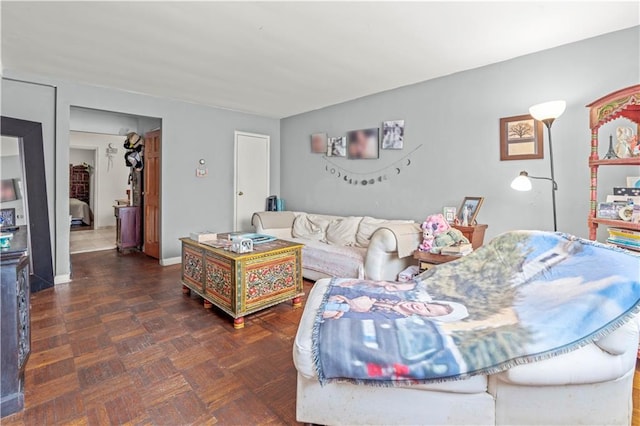 living room featuring dark parquet flooring