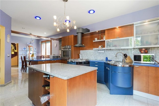 kitchen featuring hanging light fixtures, a center island, and a notable chandelier