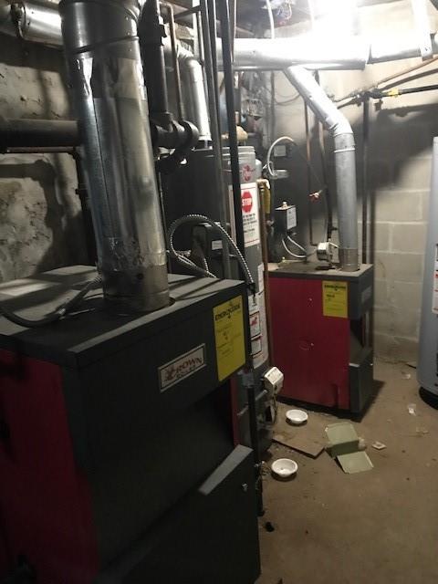 utility room featuring water heater