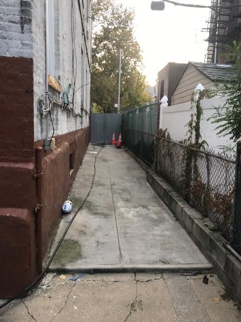 view of side of home with fence