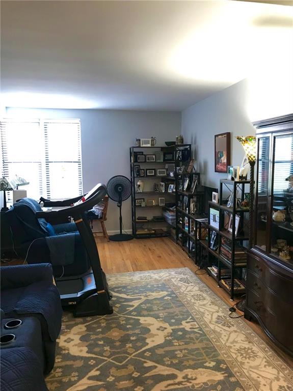 workout area with wood finished floors