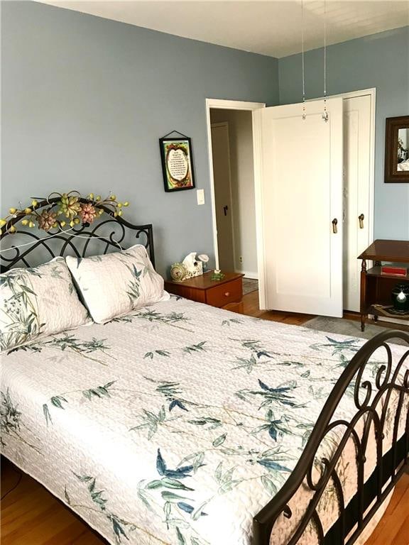 bedroom featuring wood finished floors