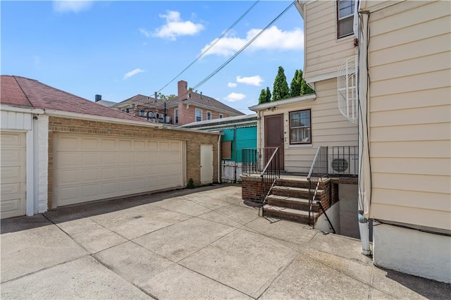 7913 20th Ave, Brooklyn, NY 11214 - view of front facade with a garage and an outdoor structure