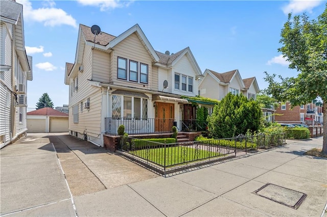 7913 20th Ave, Brooklyn, NY 11214 - view of front facade with a fenced front yard, a detached garage, and an outdoor structure