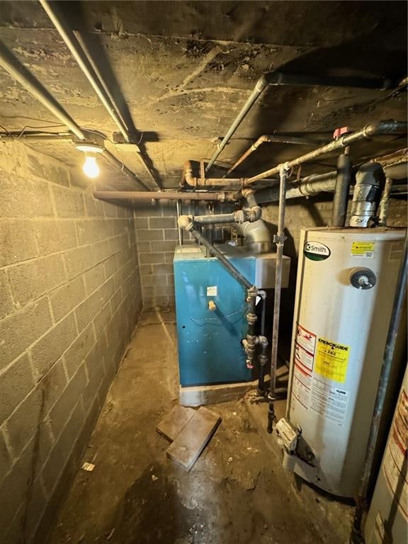 utility room featuring gas water heater