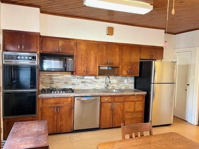 kitchen with decorative backsplash, wooden ceiling, light countertops, black appliances, and a sink