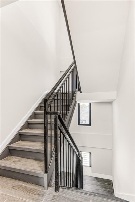 207 Bay 35th St Unit 2B, Brooklyn, NY 11214 - stairs with wood finished floors and baseboards