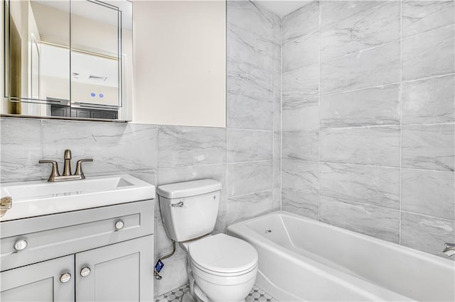 full bathroom with vanity, tile walls, and toilet