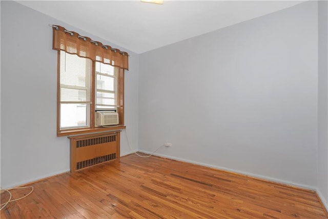 2331 Ocean Ave Unit 6C, Brooklyn, NY 11229 - empty room featuring radiator, light wood-style flooring, baseboards, and cooling unit
