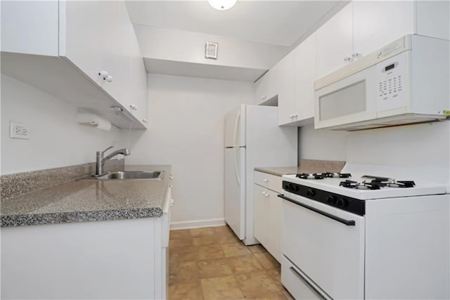 kitchen featuring white cabinetry, white appliances, stone countertops, and sink