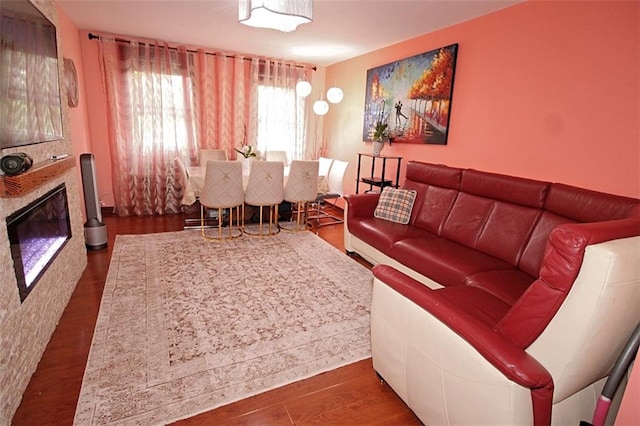 2209 Knapp St Unit 3G, Brooklyn, NY 11229 - living room featuring a glass covered fireplace and wood finished floors