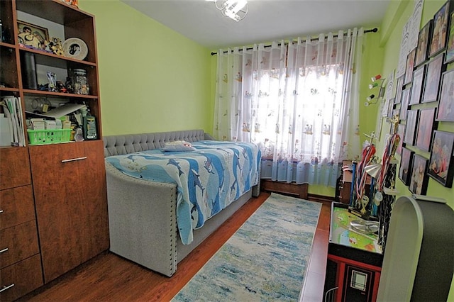 bedroom featuring wood finished floors