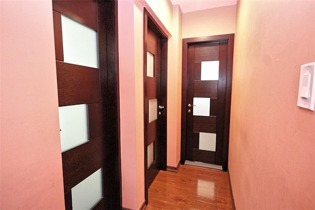 hall featuring wood finished floors