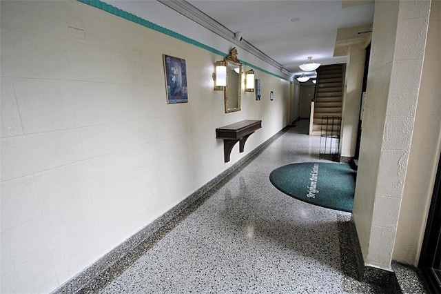 2209 Knapp St Unit 3G, Brooklyn, NY 11229 - hallway with speckle patterned floor and stairway