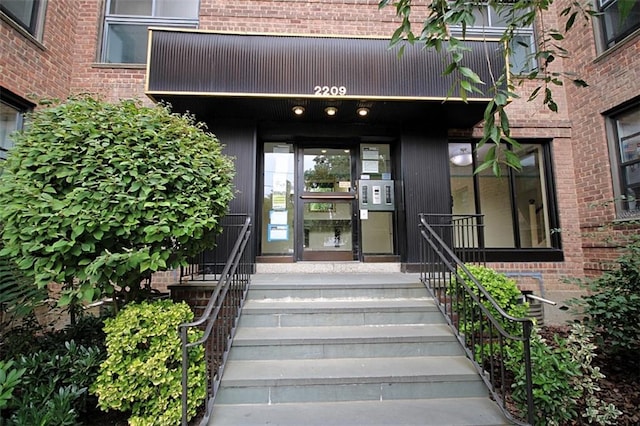 property entrance with brick siding