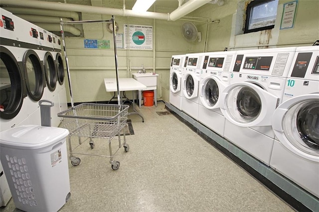 communal laundry room with separate washer and dryer