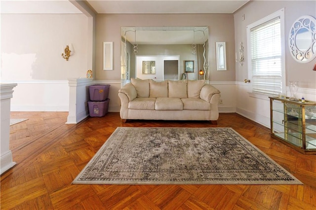 unfurnished living room featuring baseboards