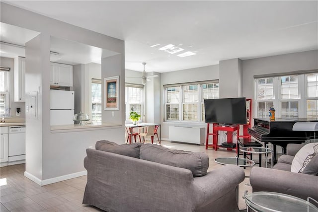 living room featuring baseboards