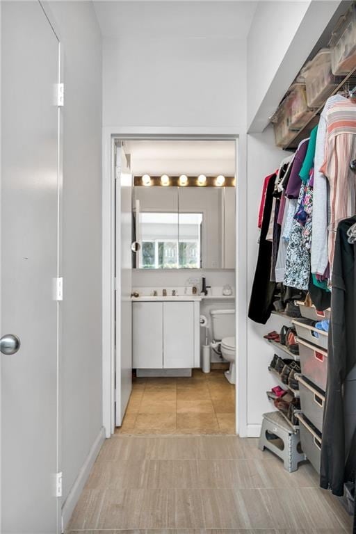 bathroom with vanity, toilet, and tile patterned floors