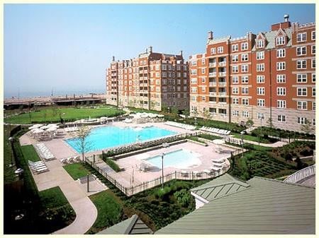 view of pool with a hot tub