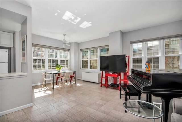 sunroom / solarium with ceiling fan