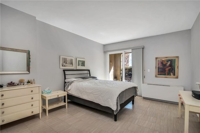 bedroom featuring access to outside and light floors