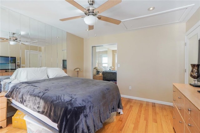 bedroom with light wood-type flooring and ceiling fan