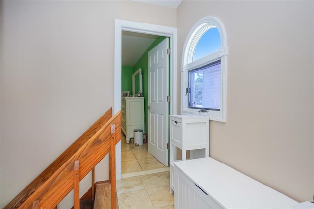 corridor with light tile patterned floors