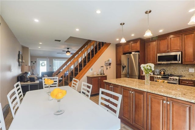 dining area with ceiling fan